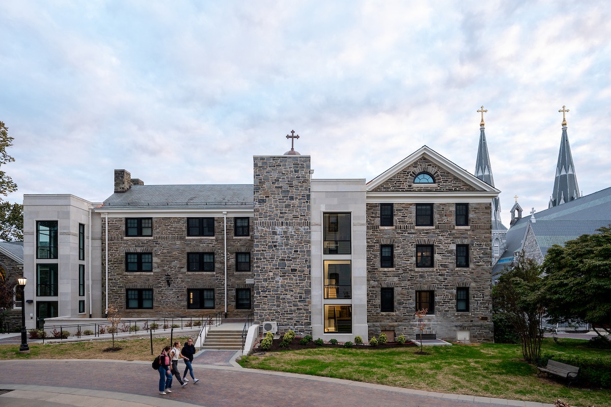 Students walk outside the newly renovated St. Rita's Hall. 