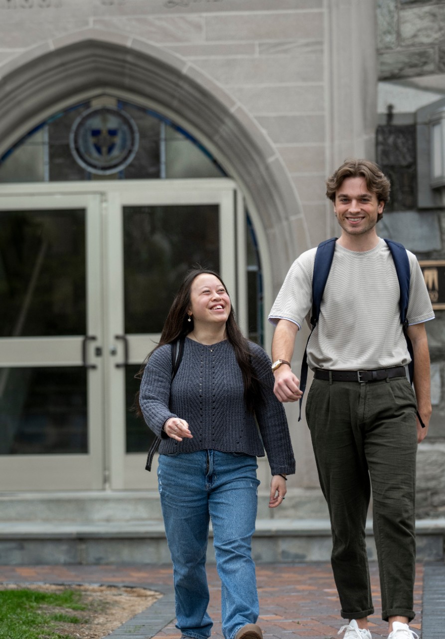 Two students walking out of teh building where the Career Center is located.