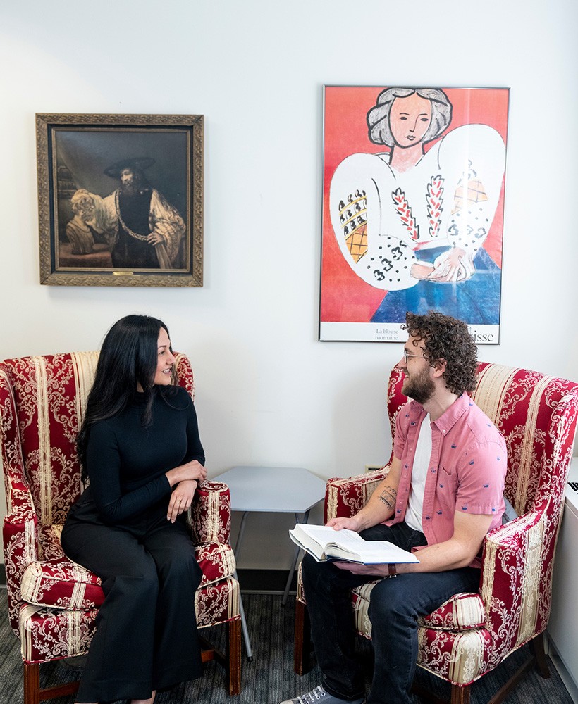Graduate students work in the library