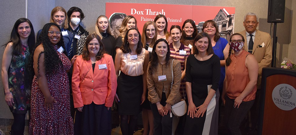 History graduate students at the opening reception of a new exhibit, Dox Thrash: Painted, Not Printed, in the Villanova University Art Gallery 