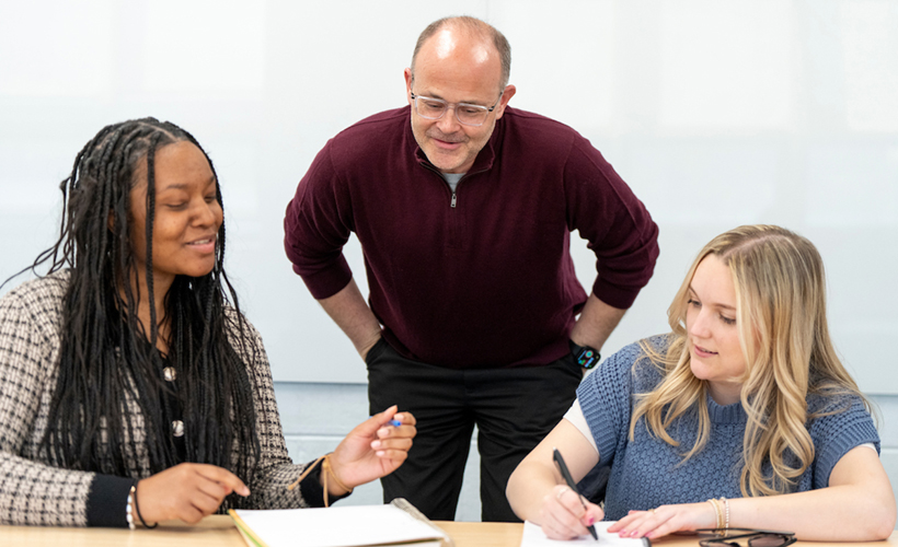 Communication Professor Bill Cowen image of Bill Cowen in class