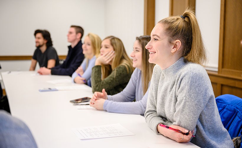 Students engage in classroom discussion. Students engage in classroom discussion.