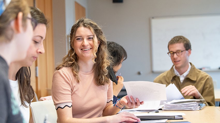 image of students and mentors at a table
