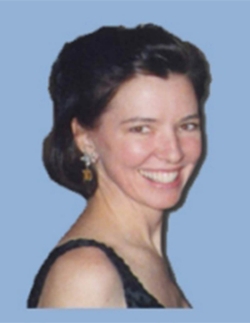 Image of Judith Connelly Delouvrier smiling against blue background