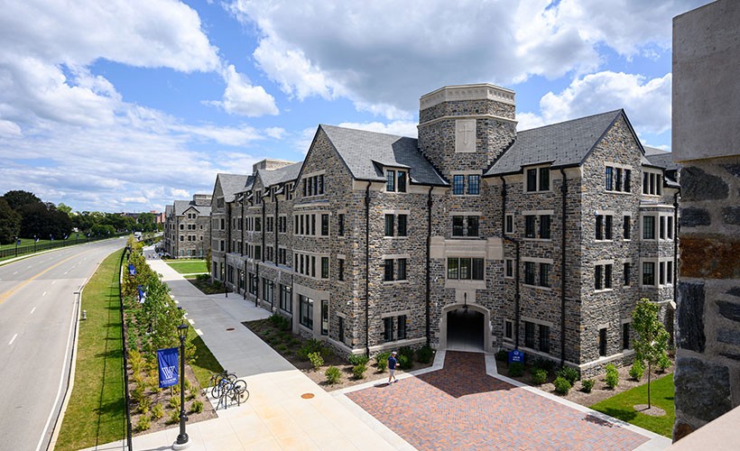 Exterior view of a corner of The Commons Residence Halls along Lancaster Avenue on campus.