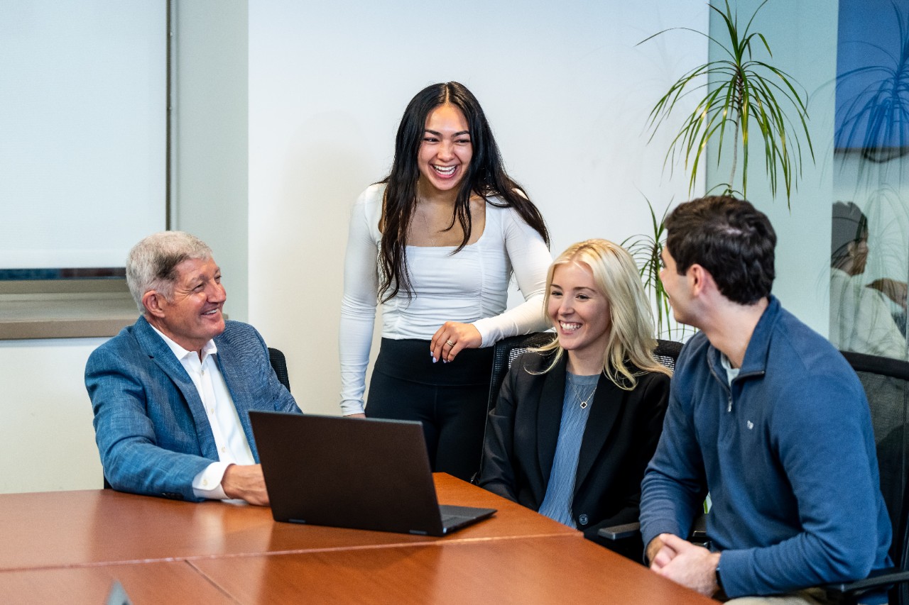 MBT students talking with professor