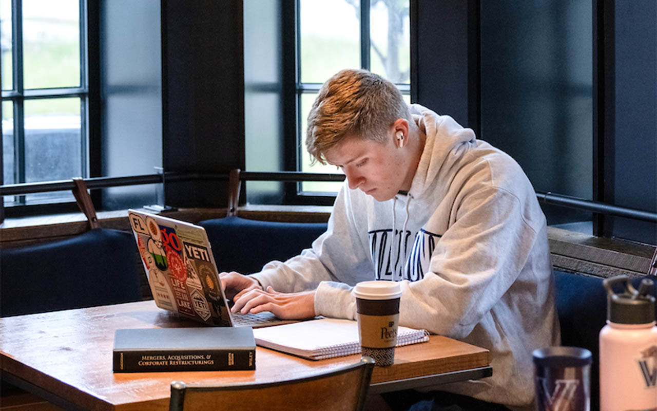 Male student working at a computer