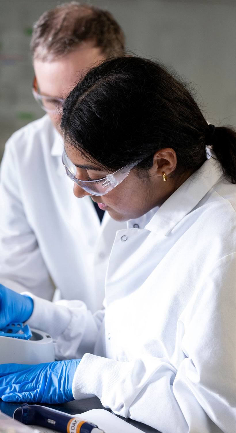 Professor and student in lab