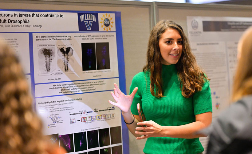 Female student presenting research