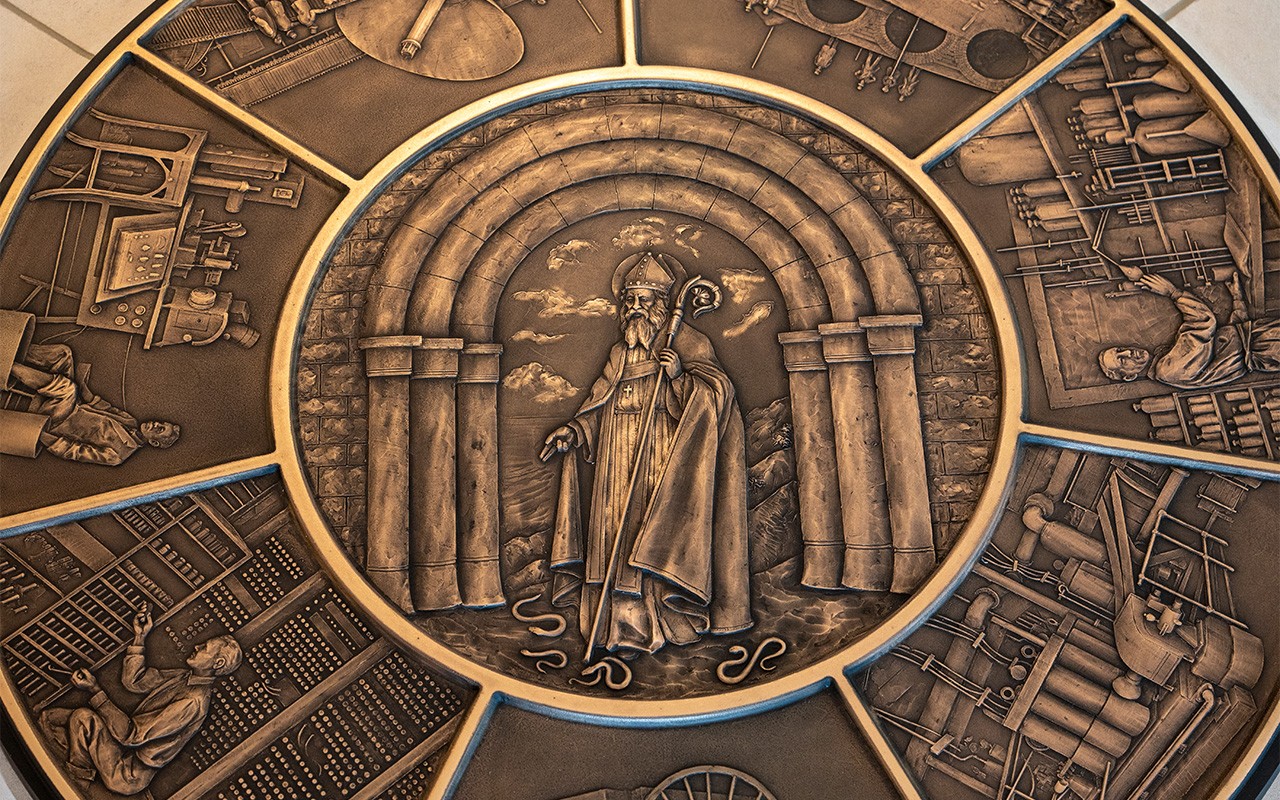 A bronze medallion of St. Patrick located in Drosdick Hall.